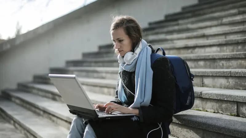 A student studying with a laptop