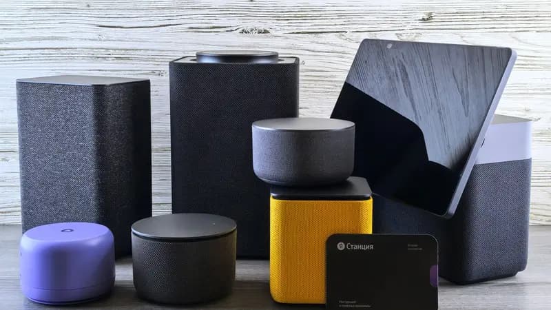 A row of different smart speakers and voice assistant devices