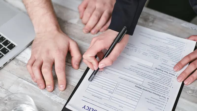A business document being reviewed and signed