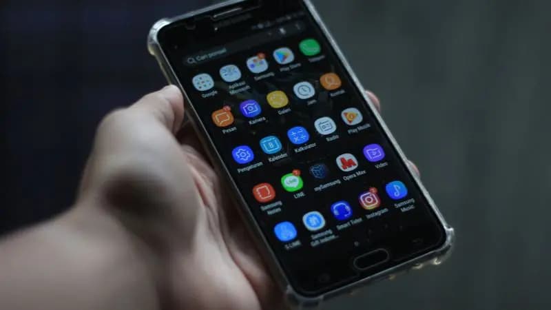 Person holding a black Android smartphone ready to get started