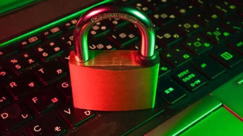 A padlock resting on a laptop keyboard
