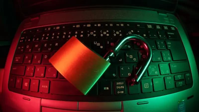 An open padlock on a laptop keyboard