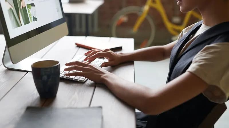A person working at a desktop computer