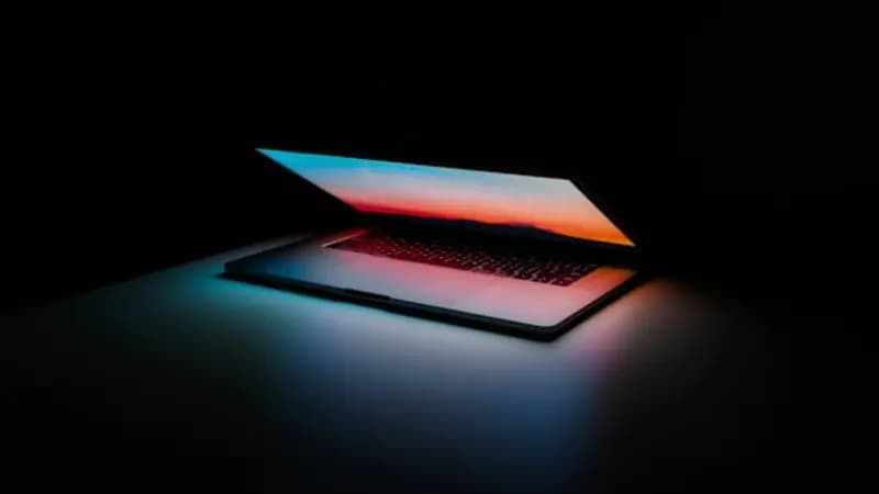 A MacBook with a glowing screen